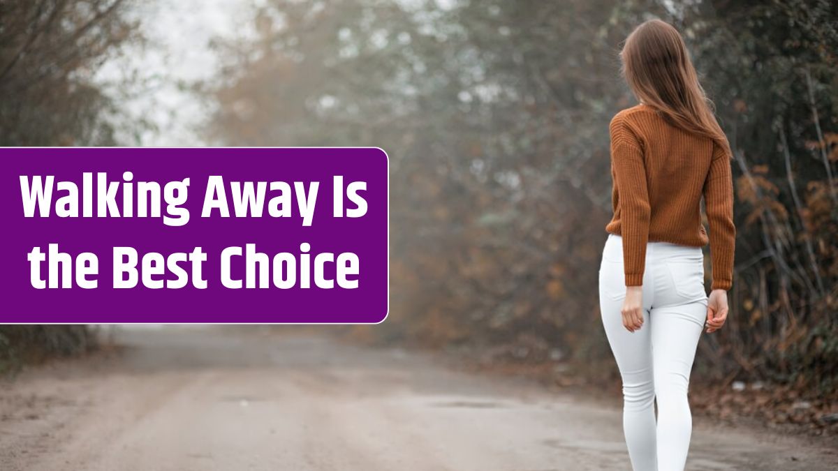 Girl in a sweater walks along a foggy road.