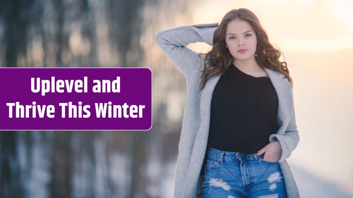 Young female wearing jeans and a black shirt paired with a cardigan in a field covered in the snow.