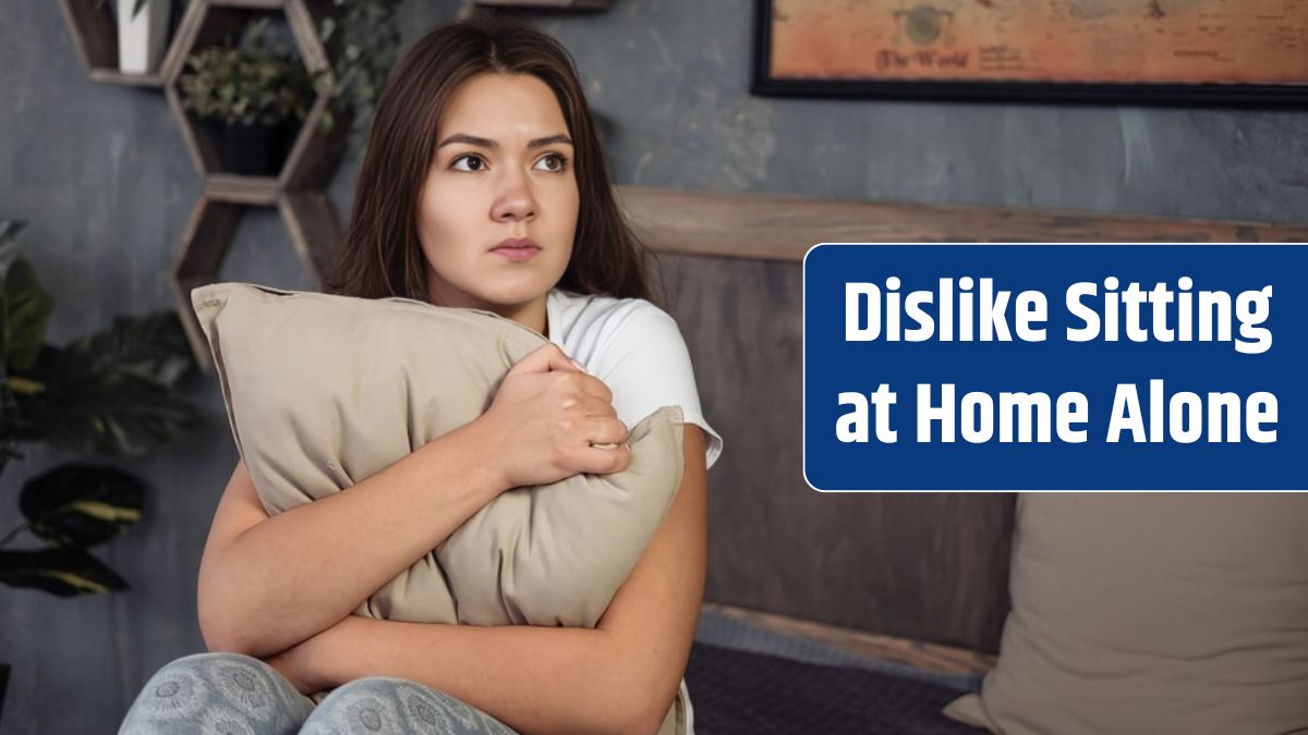 Scared woman at home embracing pillow in living room.