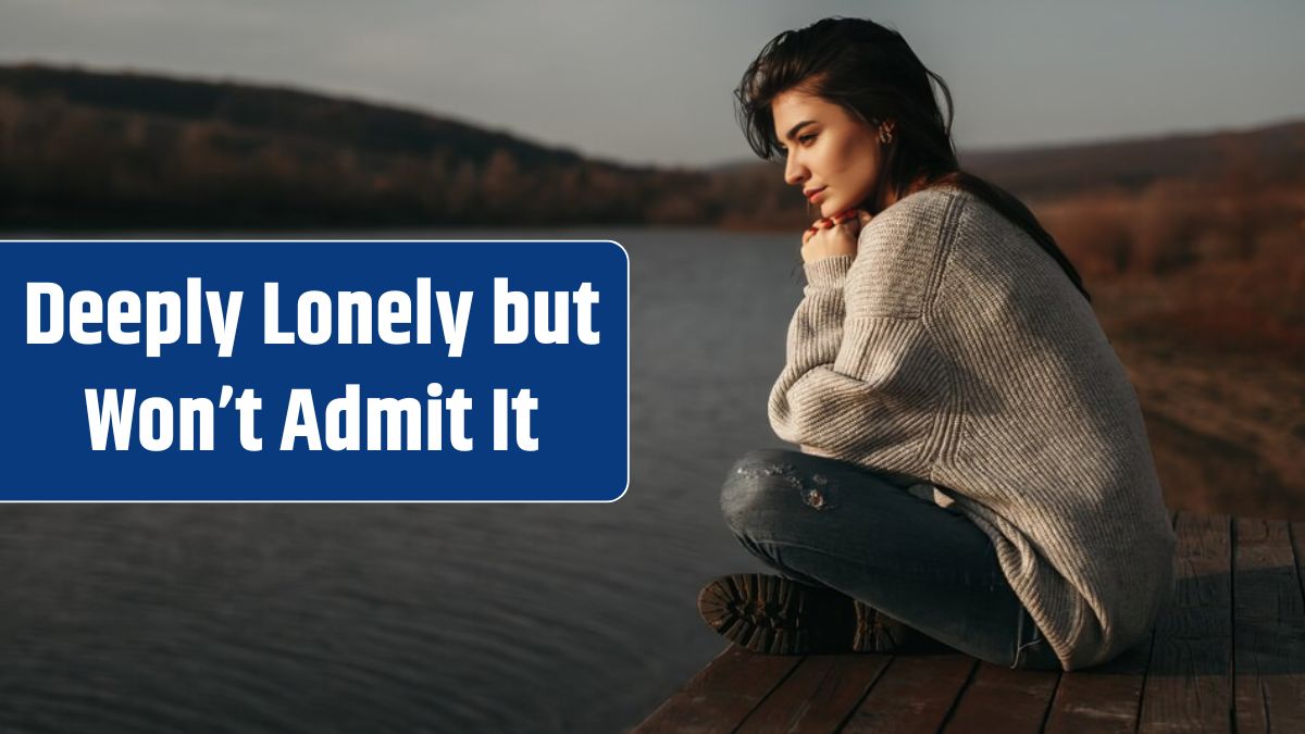 Woman admiring view of lake at sunset.