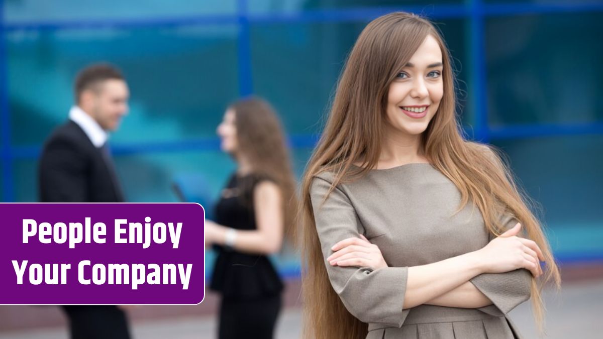 Smiling businesswoman with blurred workmates background.