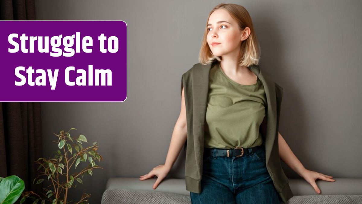 Young smiling attractive woman on dark gray wall with copy space. Serious brooding dreamy attractive young woman in a home interior with plants.