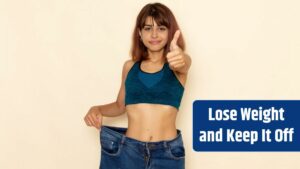 Front view of young female with fit body in blue shirt and jeans smiling on light-white wall.